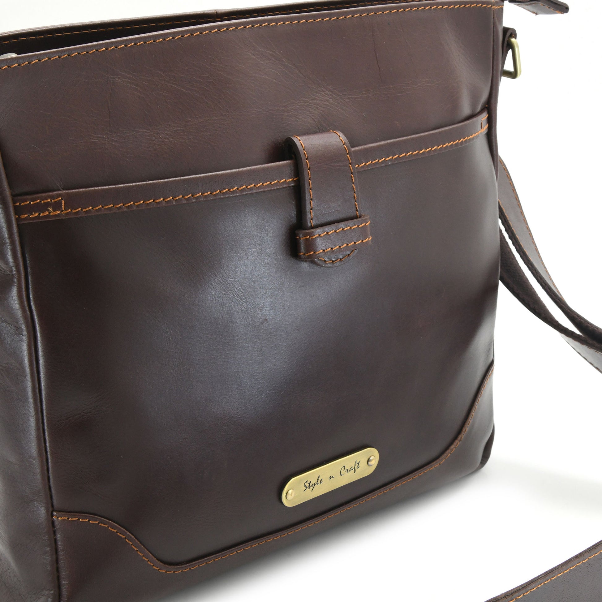 Style n Craft 392001 Cross-body Messenger Bag in Full Grain Dark Brown Leather - Front Profile View showing the Front Pocket and Logo
