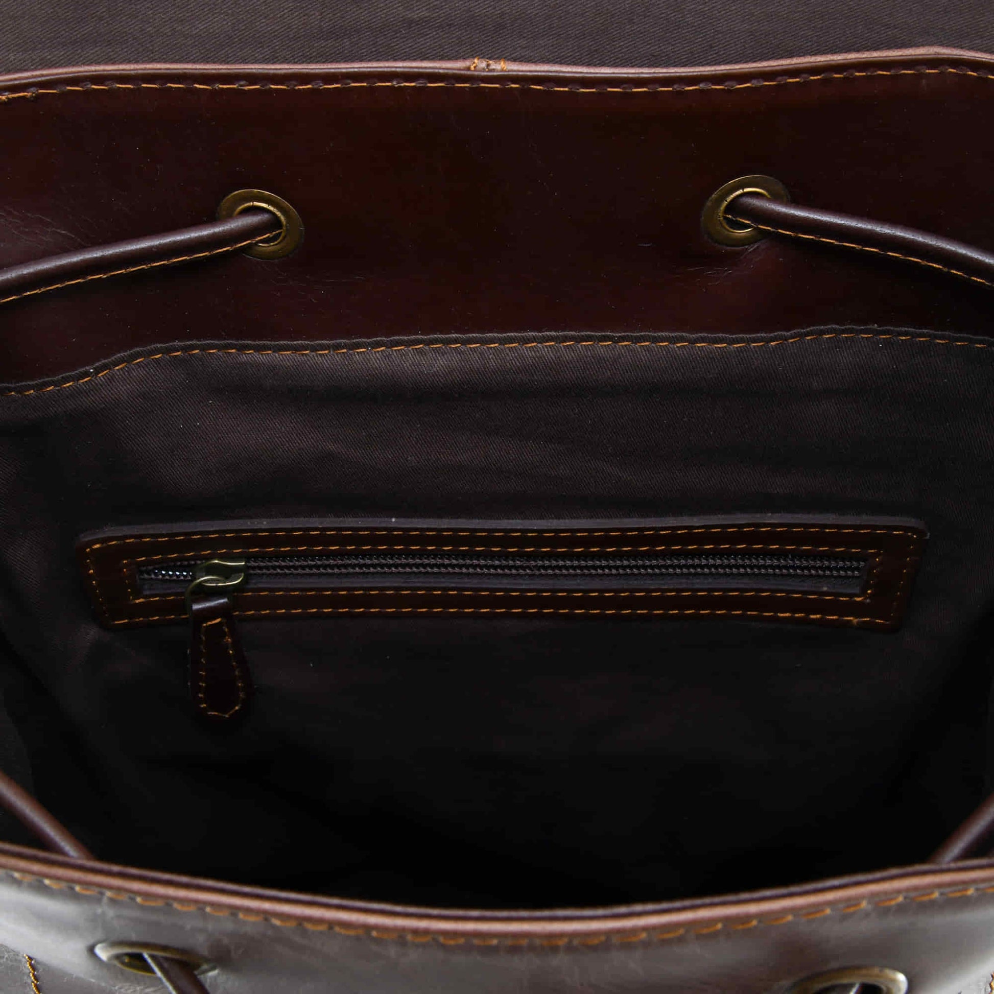 Style n Craft 392152 Tall Backpack in Light & Dark Brown Combination Full Grain Leather - Interior view of the bag showing the zipper pocket on the back wall of the backpack