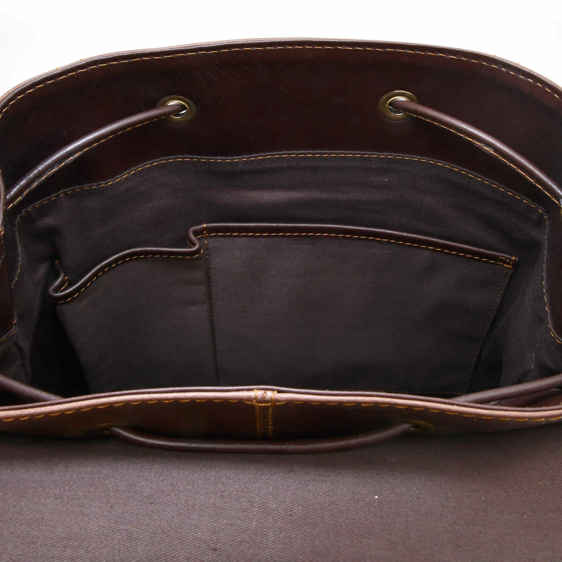 Style n Craft 392152 Tall Backpack in Light & Dark Brown Combination Full Grain Leather - Interior view of the bag showing the 2 smaller open pockets on the front wall of the backpack