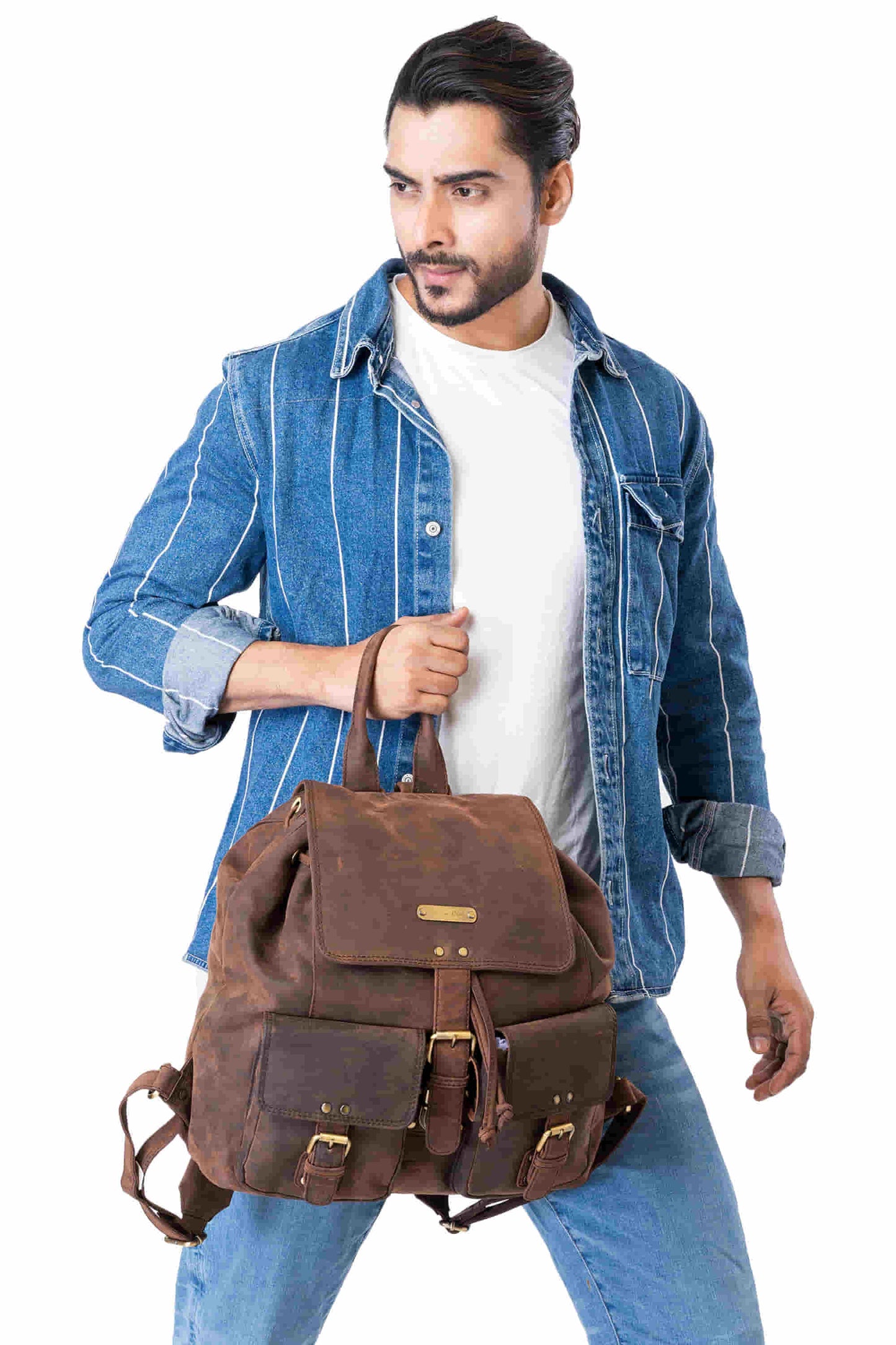Style n Craft 392650 Backpack in Full Grain Dark Brown Hunter Leather - in use - holding the backpack by the top leather strap