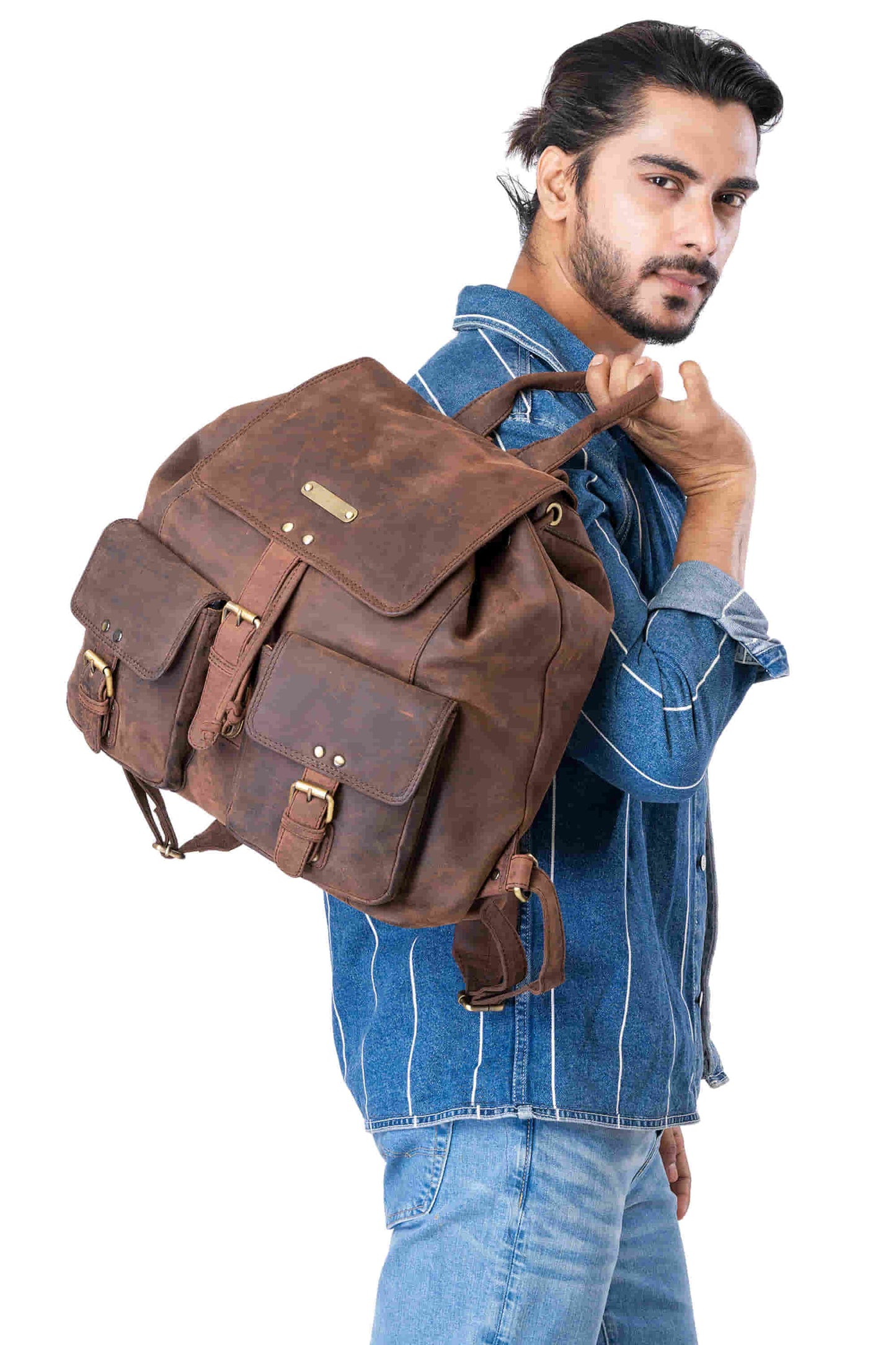 Style n Craft 392650 Backpack in Full Grain Dark Brown Hunter Leather - in use - slinging the backpack over the shoulder by the top leather strap