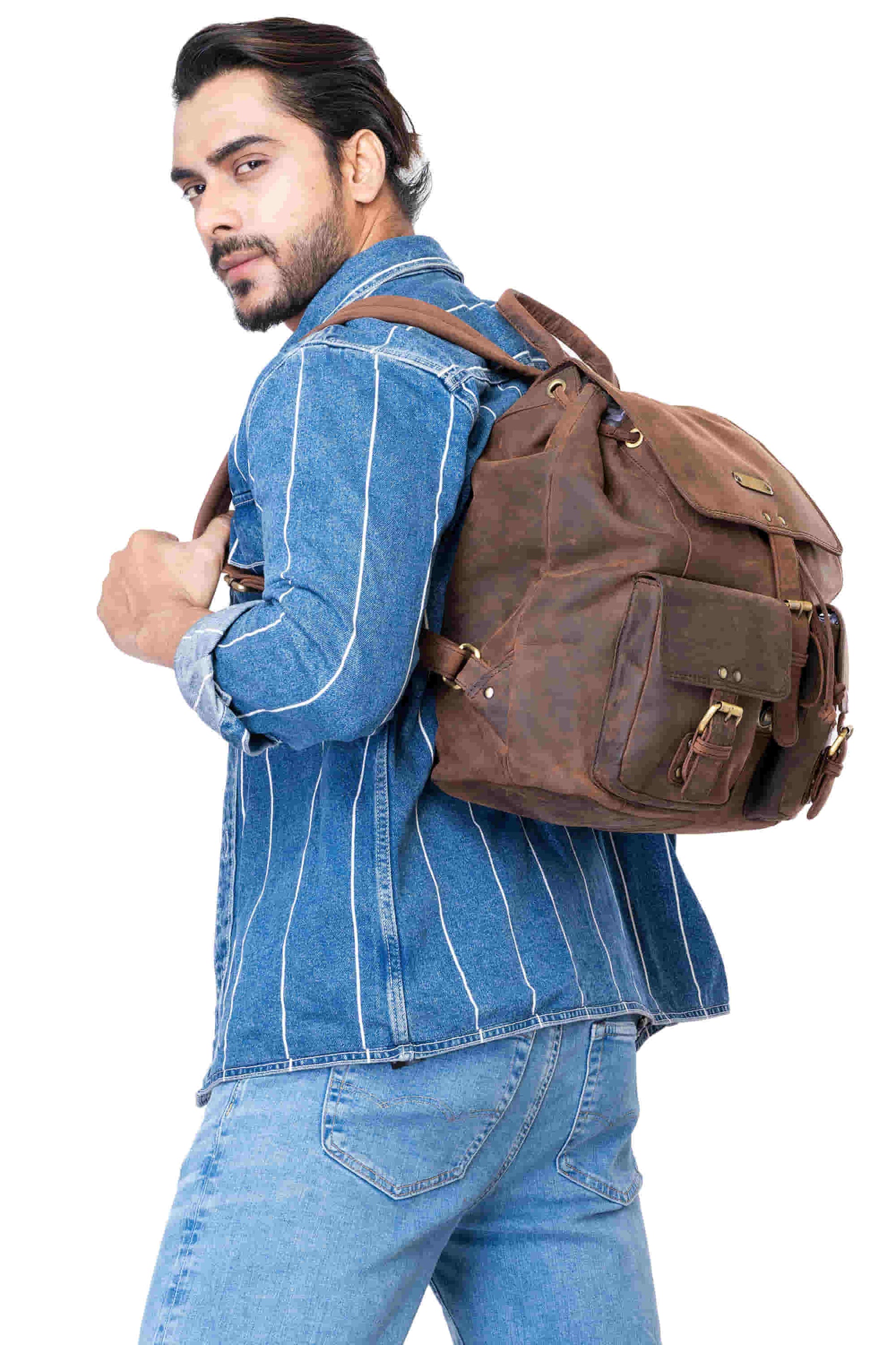 Style n Craft 392650 Backpack in Full Grain Dark Brown Hunter Leather - in use - carrying the backpack on the back using the leather shoulder straps - side view